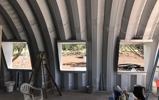 Clever Moderns Quonset hut house construction window installation