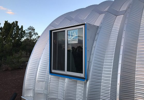 Clever Moderns Quonset hut house construction window installation