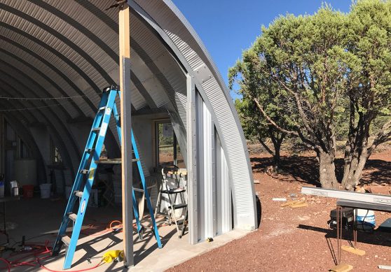 Clever Moderns Quonset hut house construction window installation