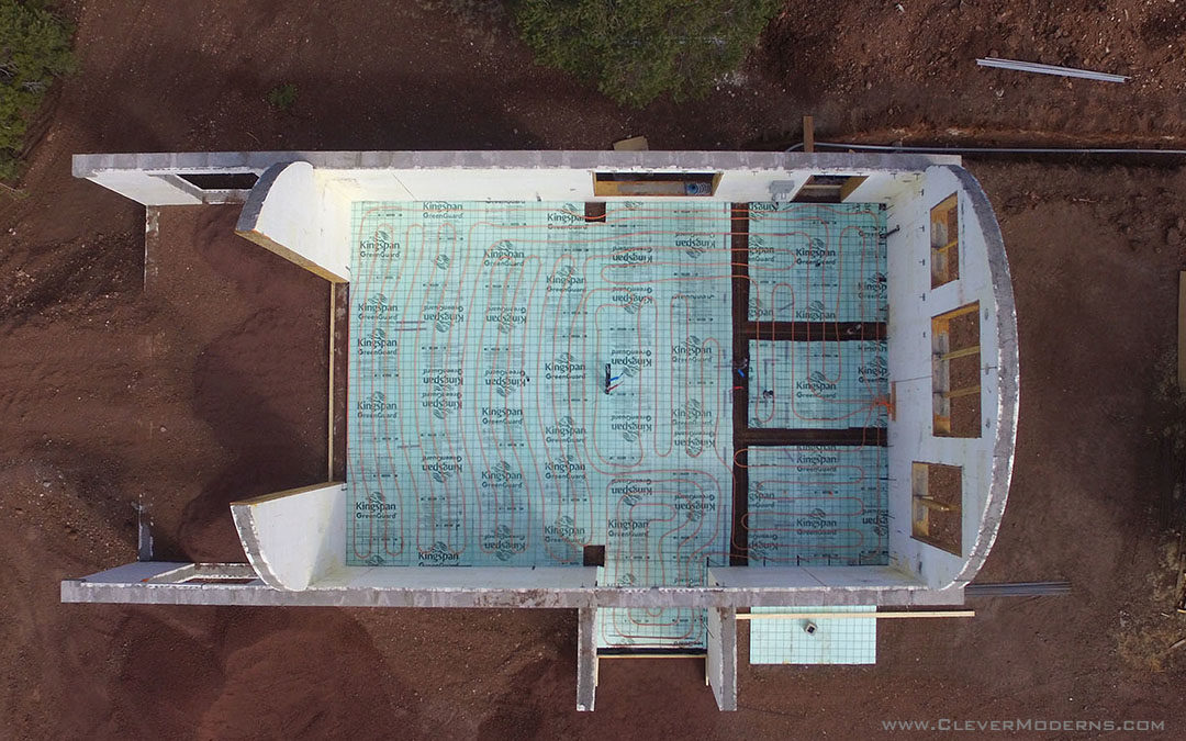 Aerial view of Quonset hut under construction showing radiant floor tubing.